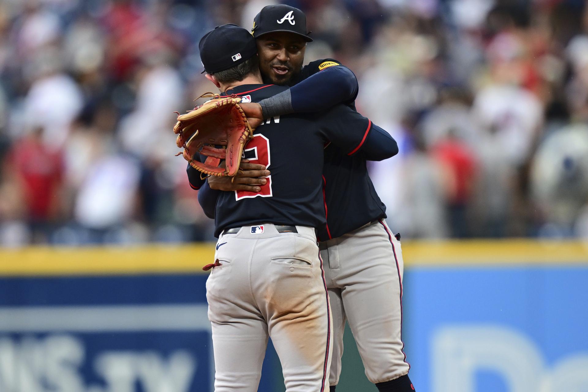 Ozzie Albies hugs Nick Allen