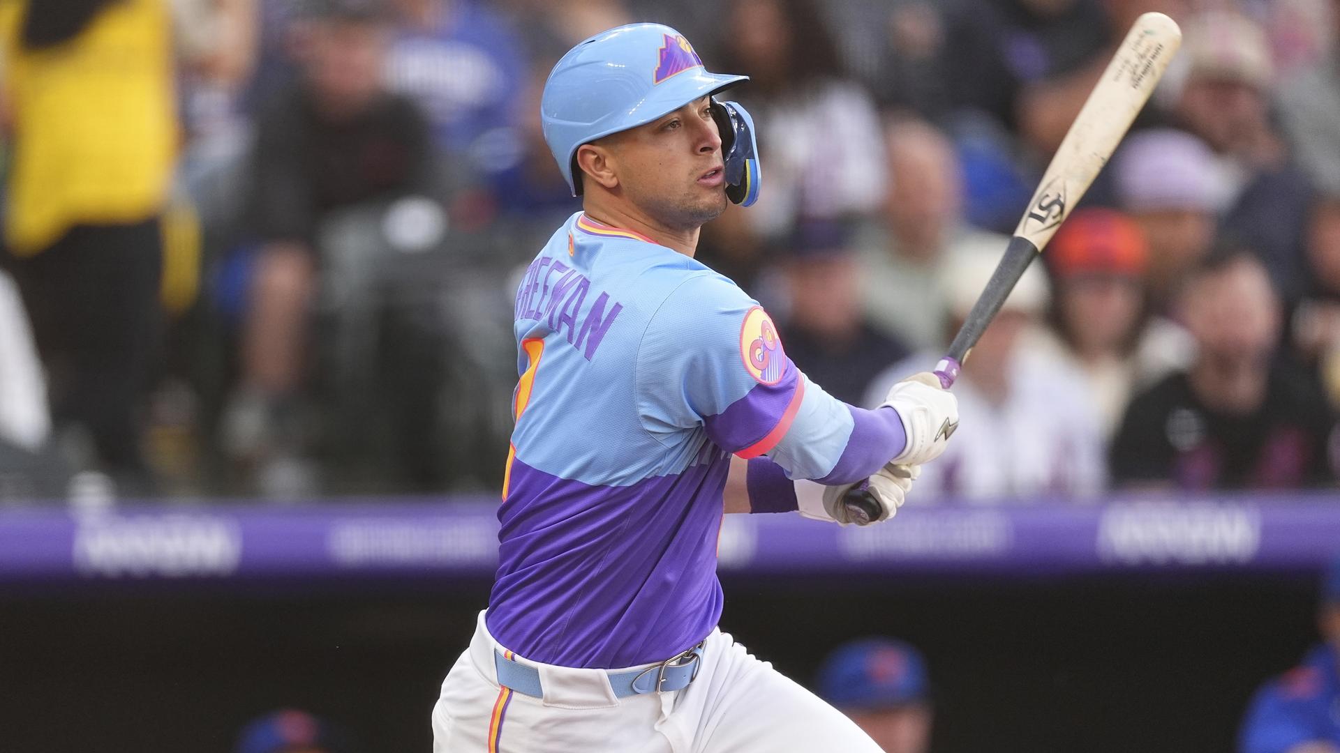Tyler Freeman taking a hack at Coors Field