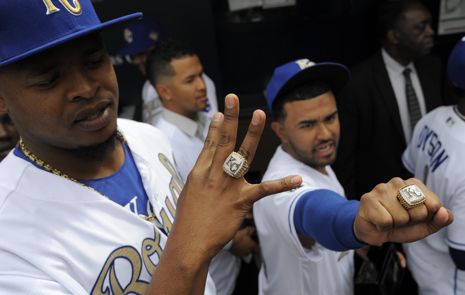 Edinson Volquez (left) displays his World Series ring