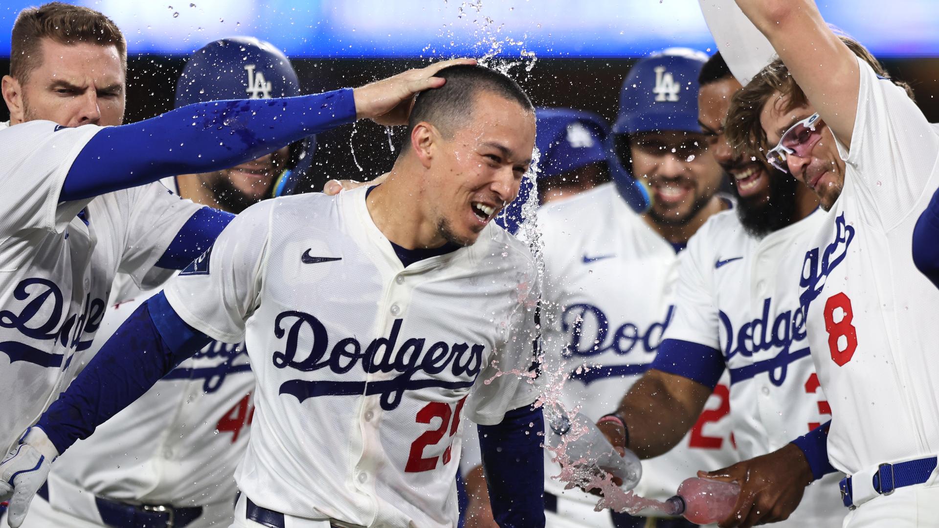 Tommy Edman celebrates hitting a walk-off two-run single