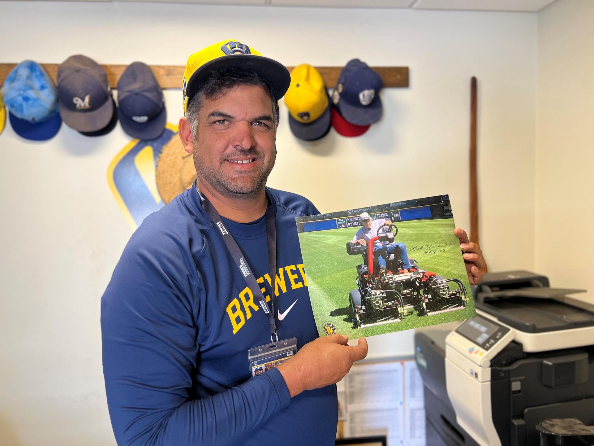 Photo of Bob Uecker on a mower