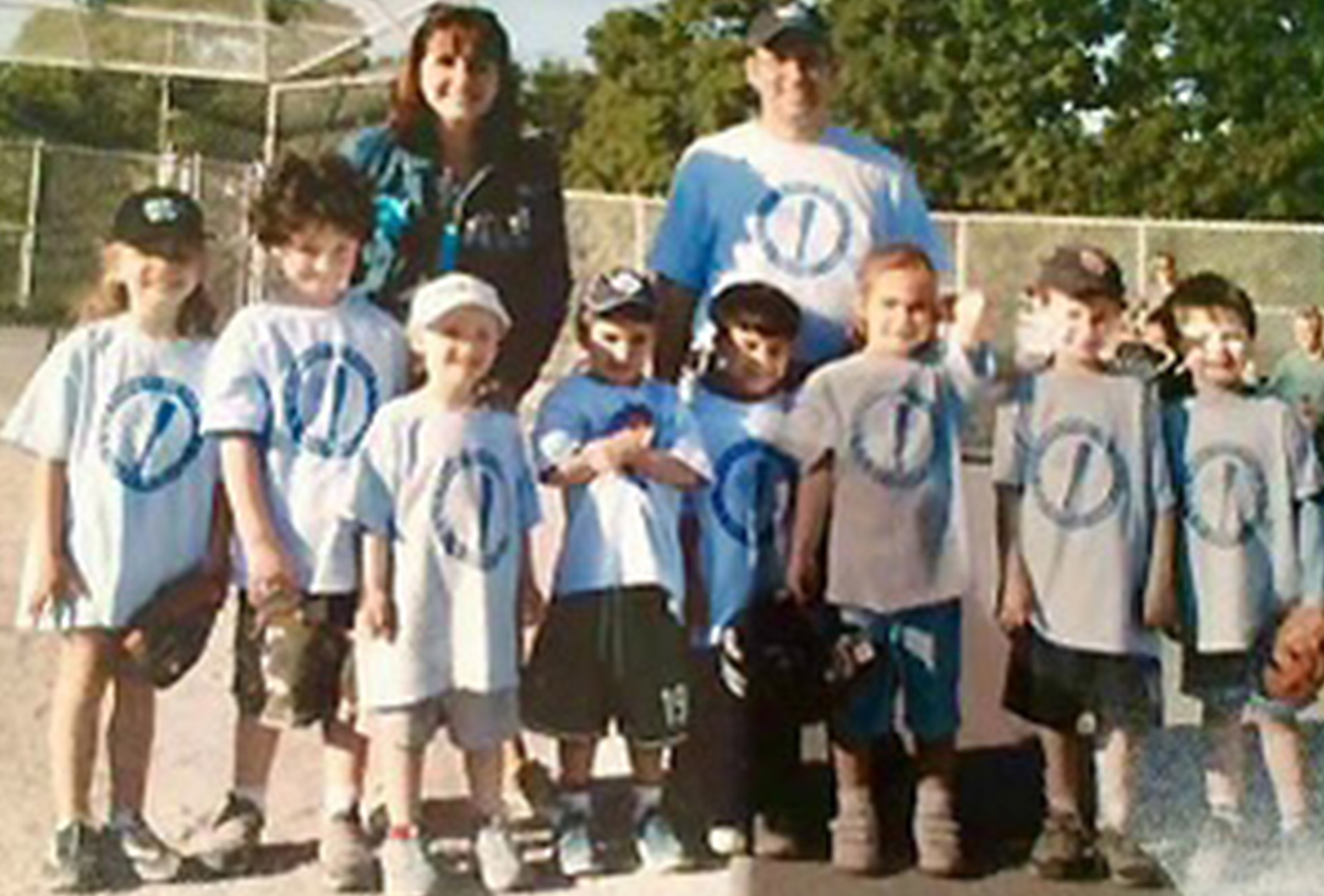 Liam Hicks, right, with his Tee Ball team and his mom, Jennifer