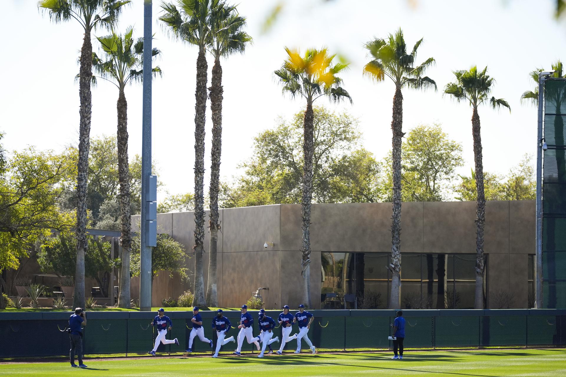 Dodgers running below palm trees