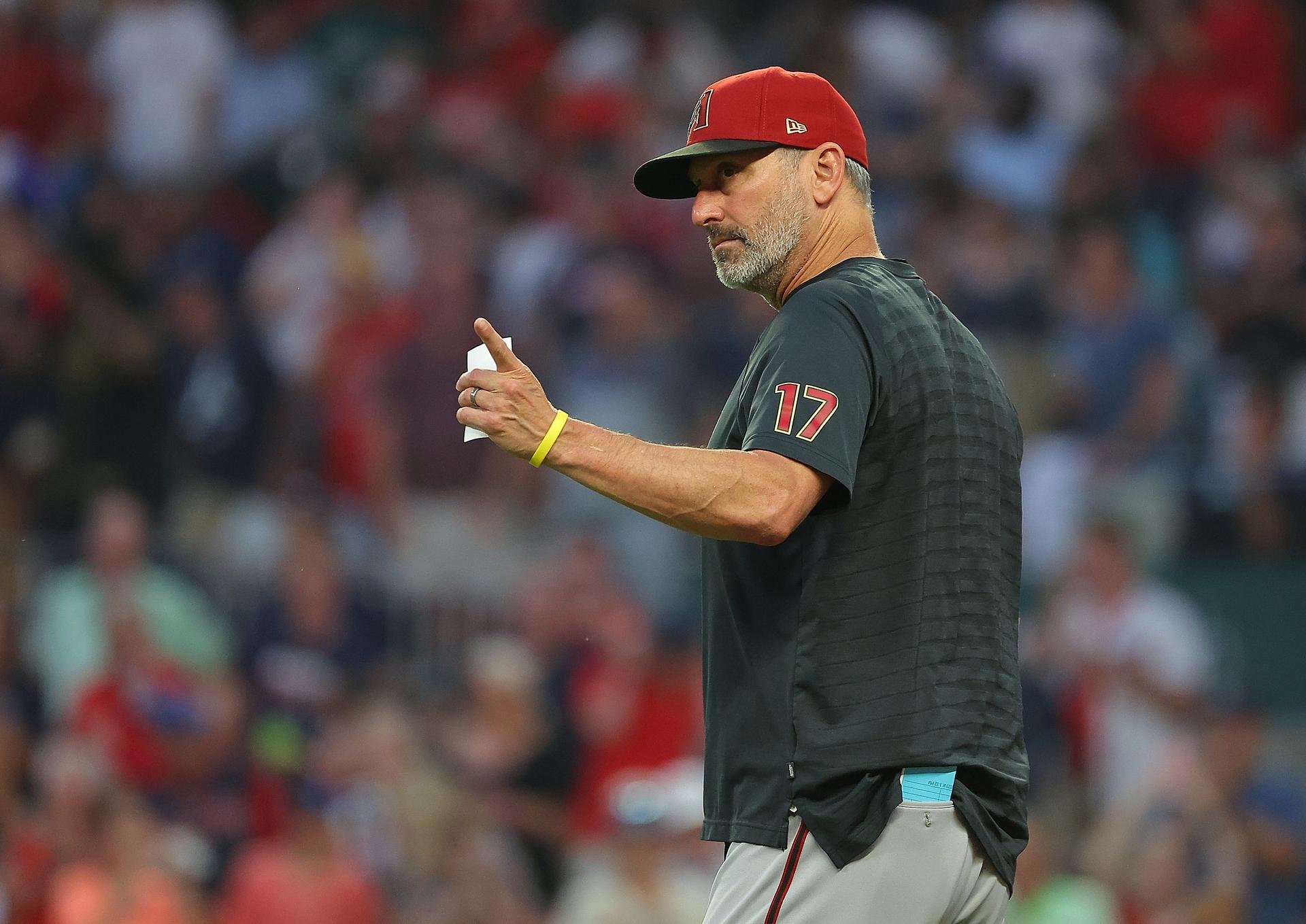 Torey Lovullo signals to the bullpen