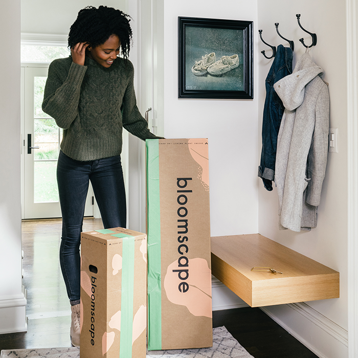 Woman receiving her bloomscape packages