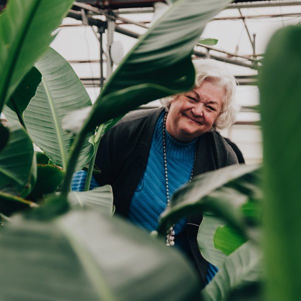 Plant Mom Joyce Mast in the greenhouse