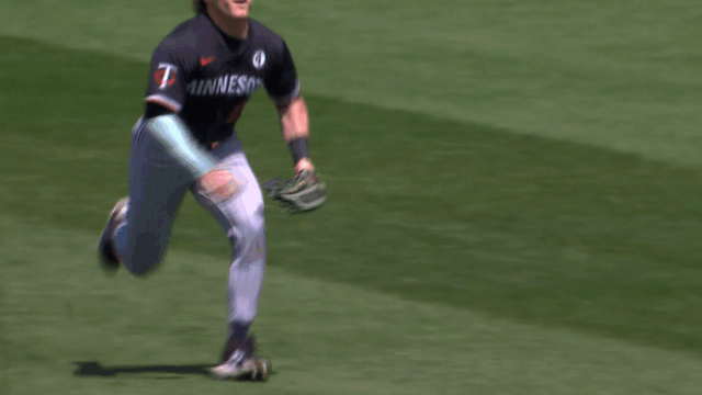 An animated gif of Twins outfielder Harrison Bader making a diving catch