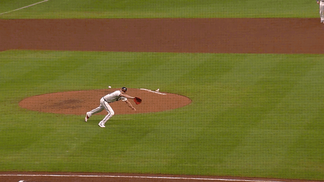 An animated GIF of Chris Sale making a diving stop and throwing to first for the out
