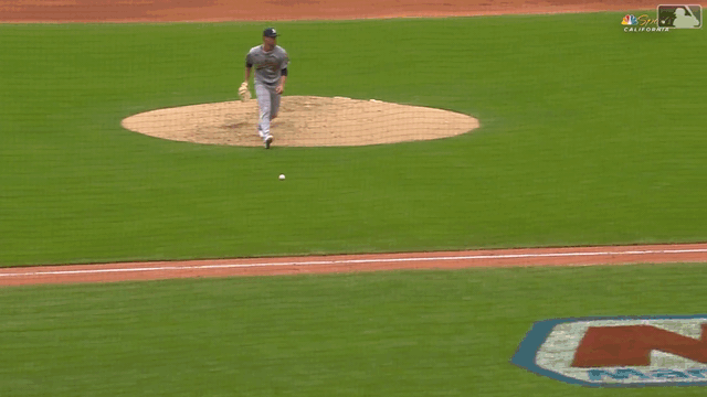 A GIF of Nick Kurtz making a barehand flip to home plate