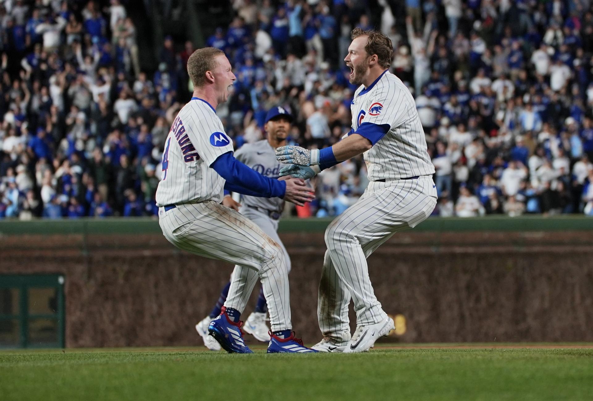 Pete-Crow Armstrong and Ian Happ celebrate the Cubs' win