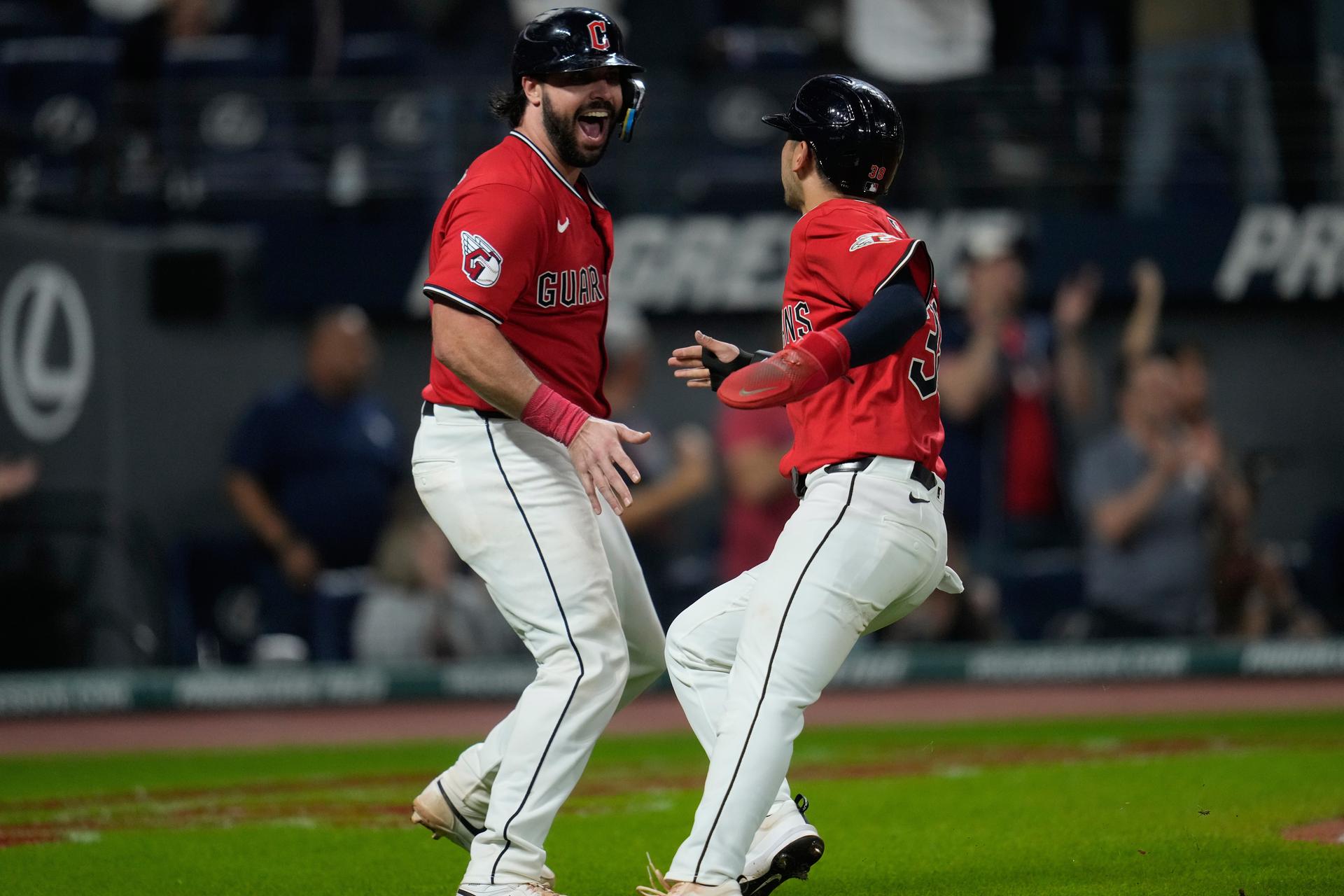 Austin Hedges and Steven Kwan celebrate