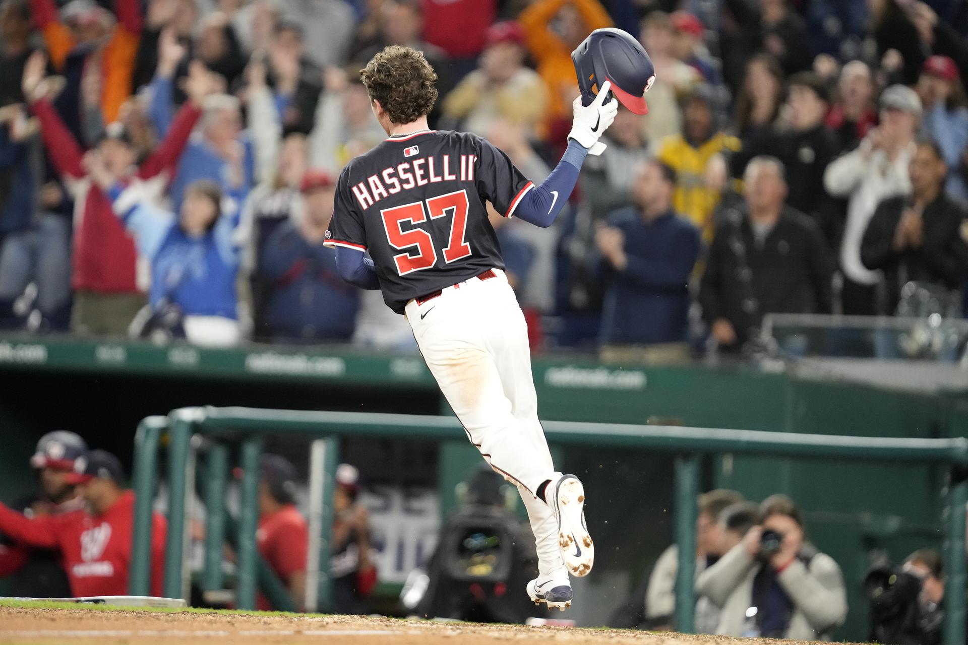 Robert Hassell III scores the winning run in his MLB debut