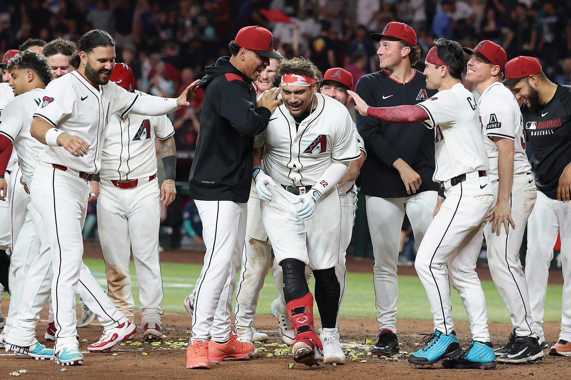 Josh Naylor is mobbed after his walk-off slam