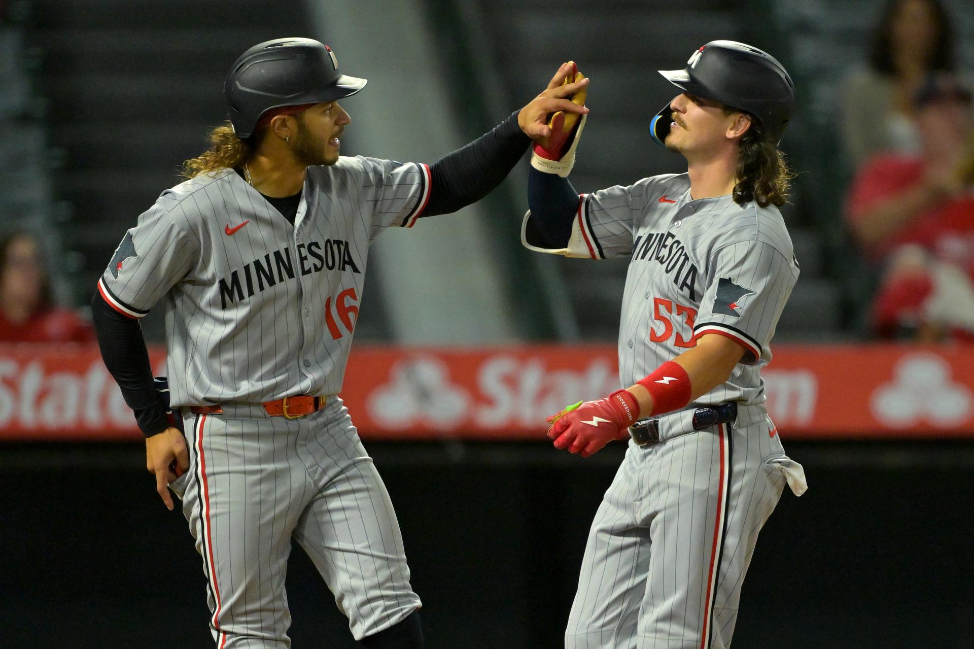 Ryan Fitzgerald (right) is congratulated on his homer