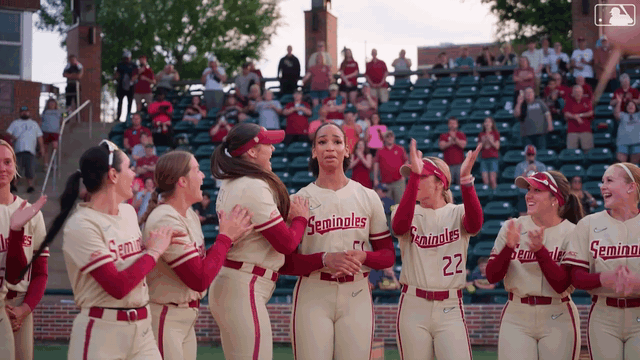 Michaela Edenfield jumping for joy with her teammates