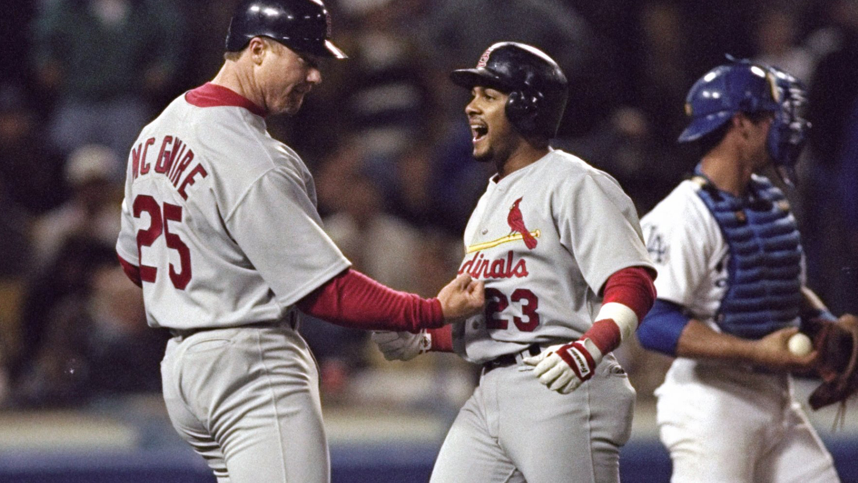 Fernando Tatis Sr. (center) celebrates his amazing feat