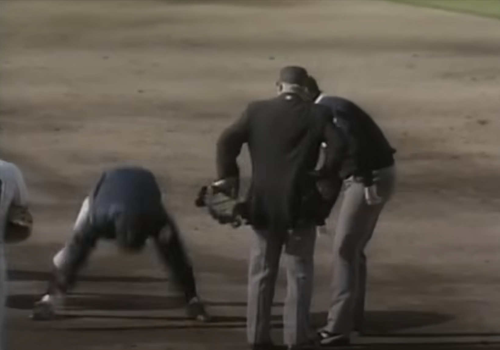Billy Martin tosses dirt at an umpire