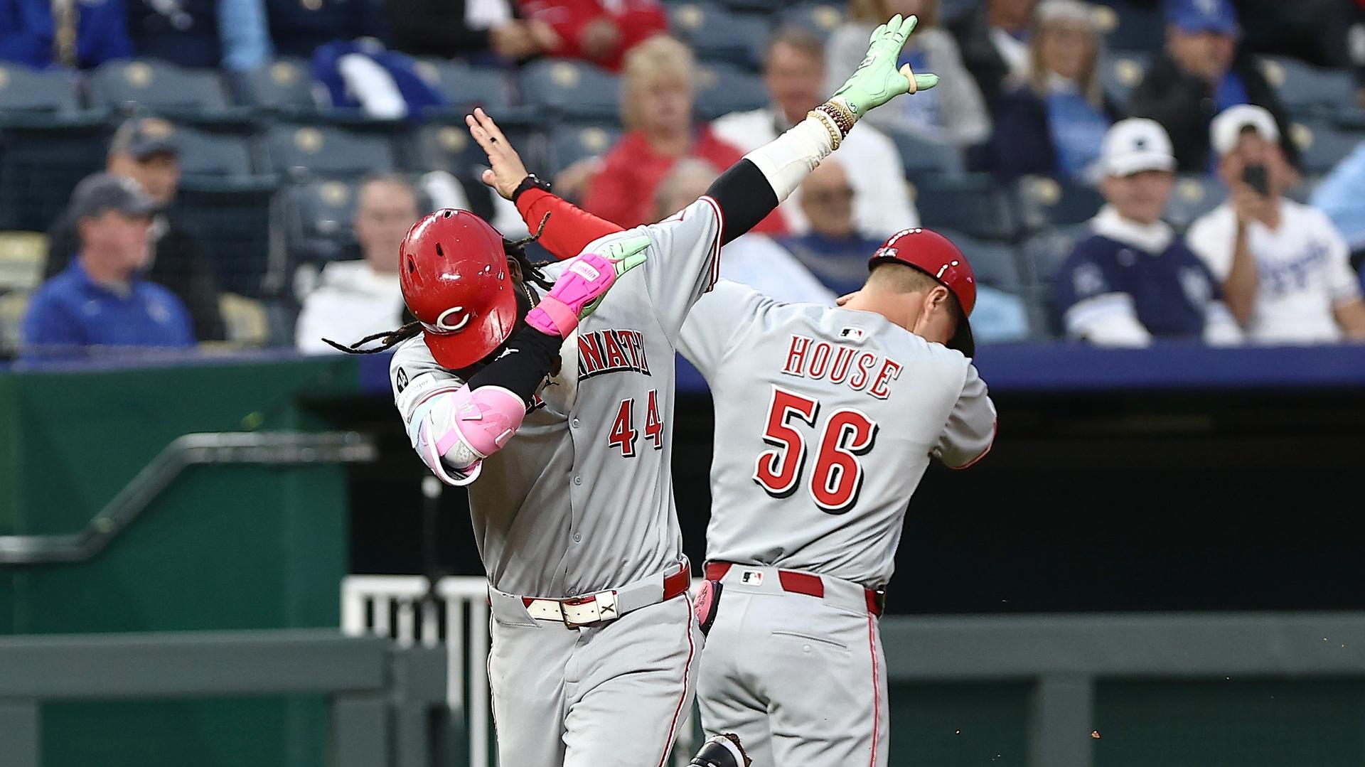 Elly De La Cruz celebrates with third-base coach J.R. House after hitting a home run