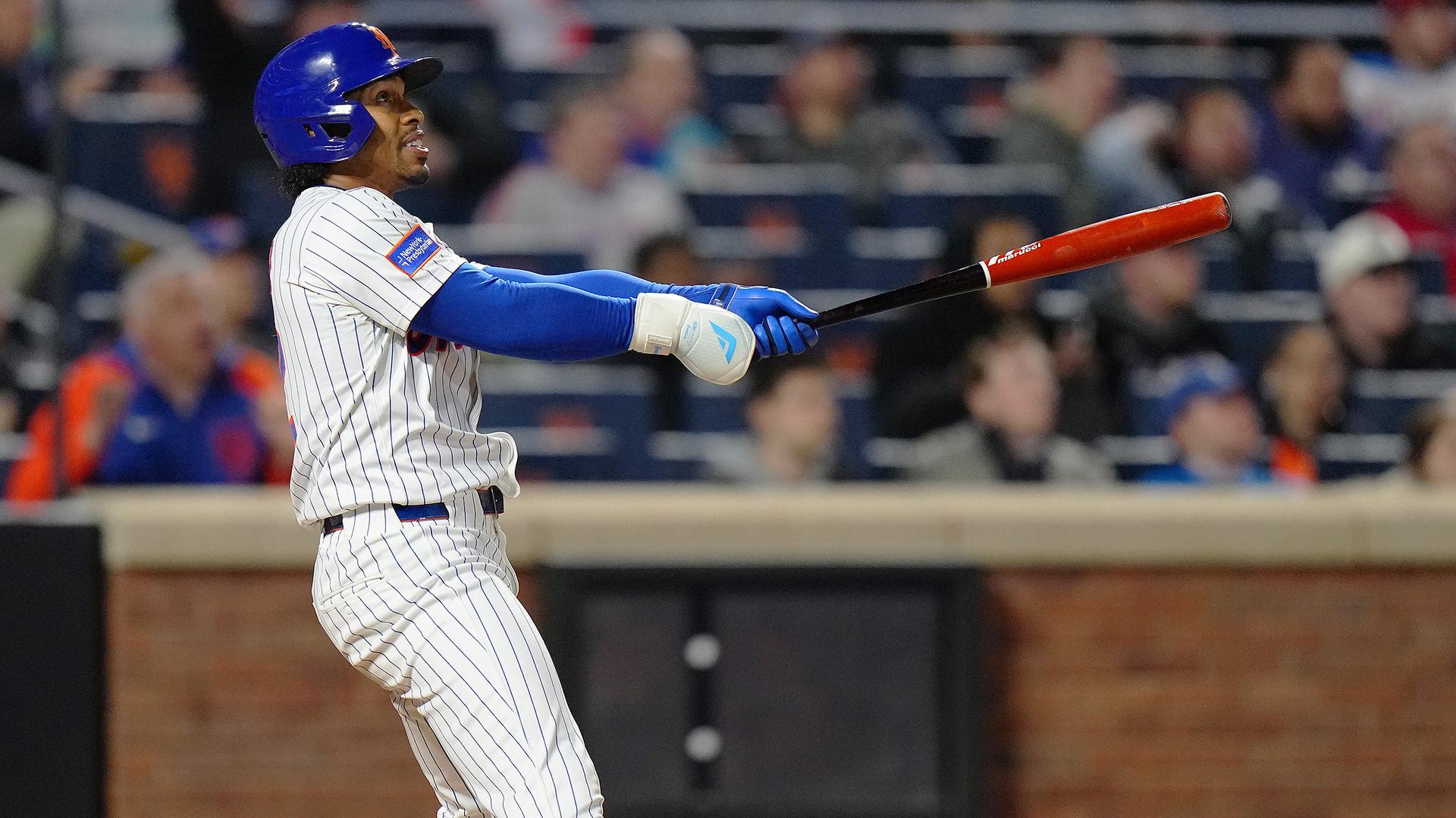 Francisco Lindor follows through on his three-run home run vs. the Phillies