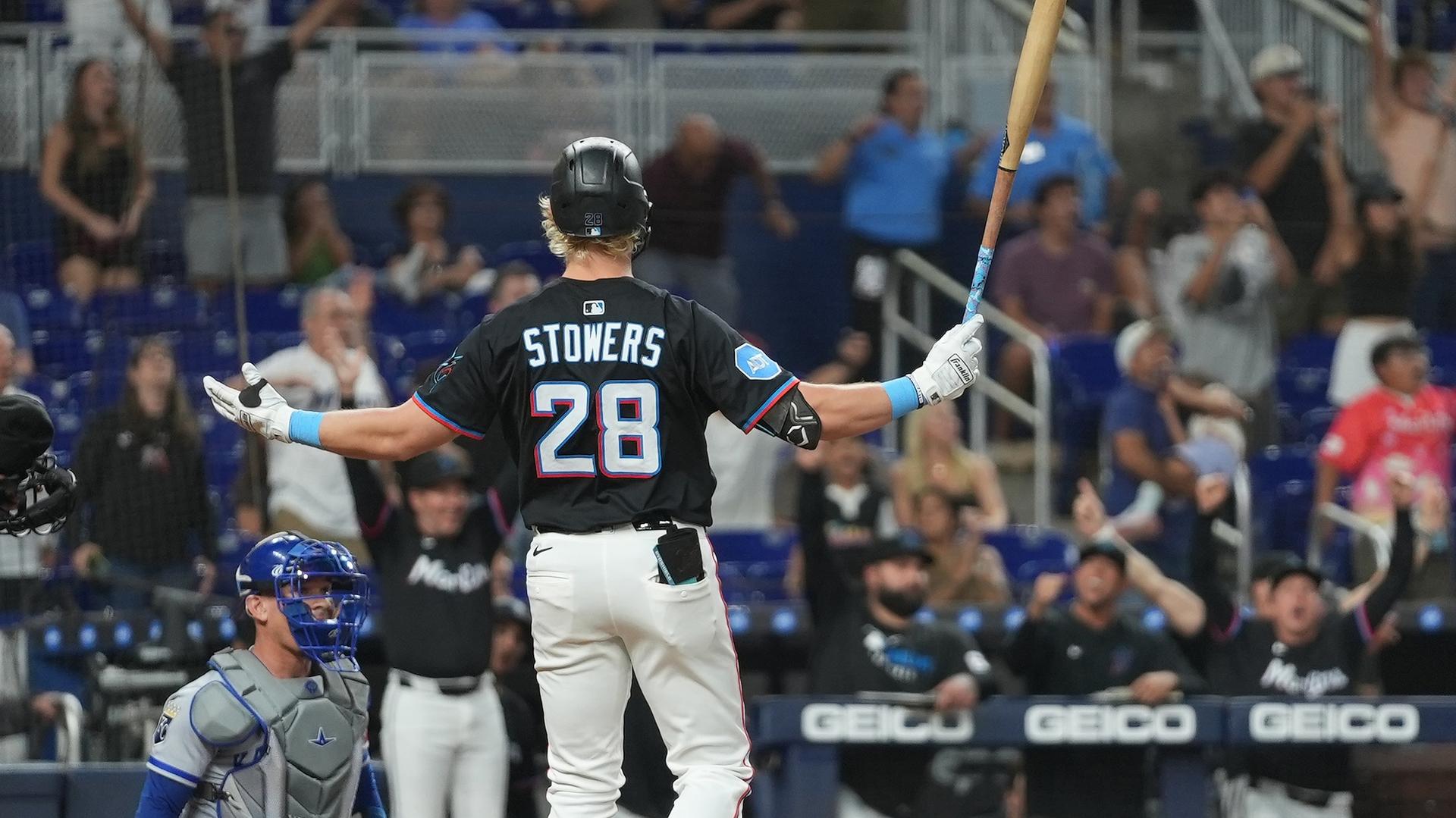 Kyle Stowers turns to the Marlins' dugout to celebrate his walk-off home run
