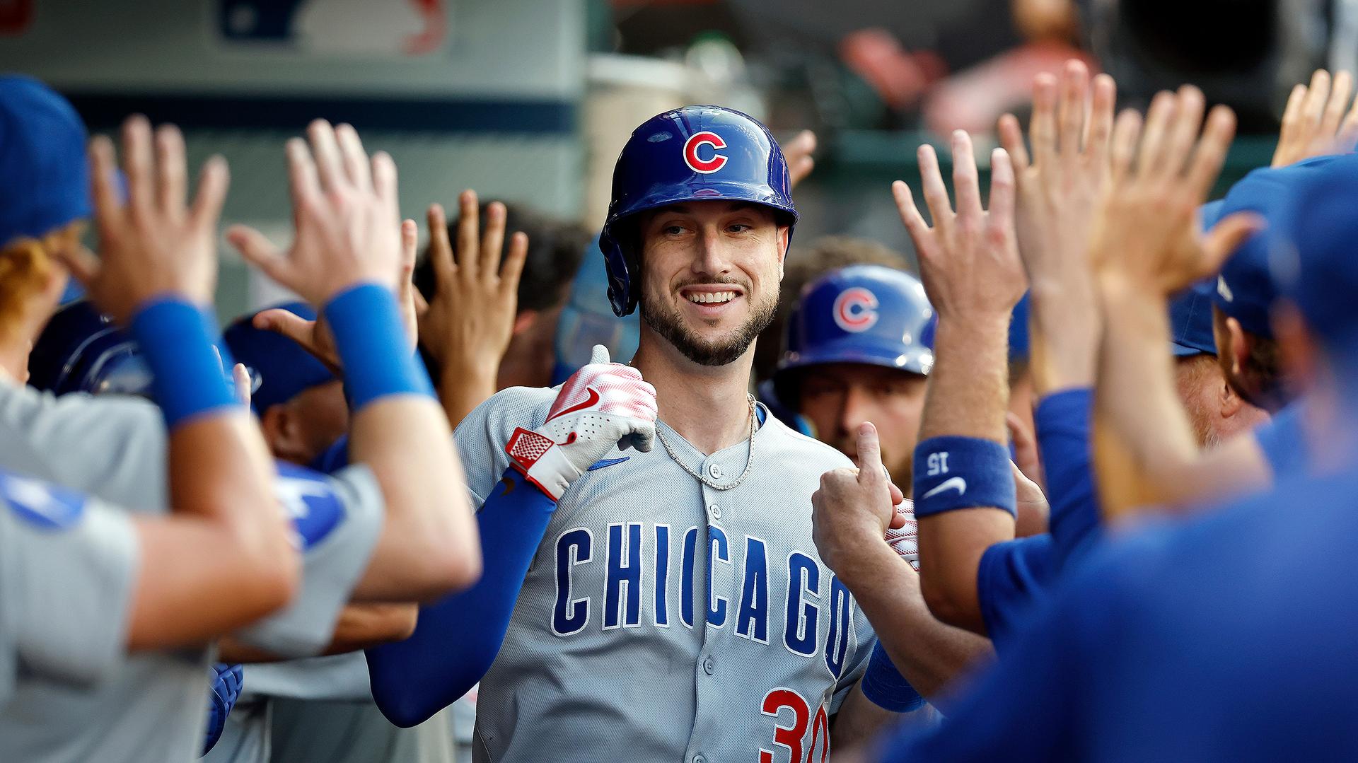 Kyle Tucker gets high-fives in the dugout after his first of two homers