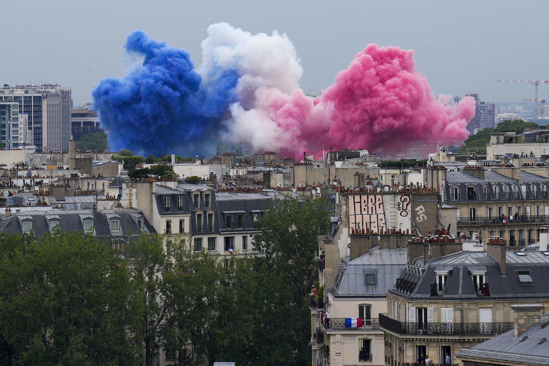 Smoke in the colors of the French flag released over Paris during the Olympics' opening ceremony. 