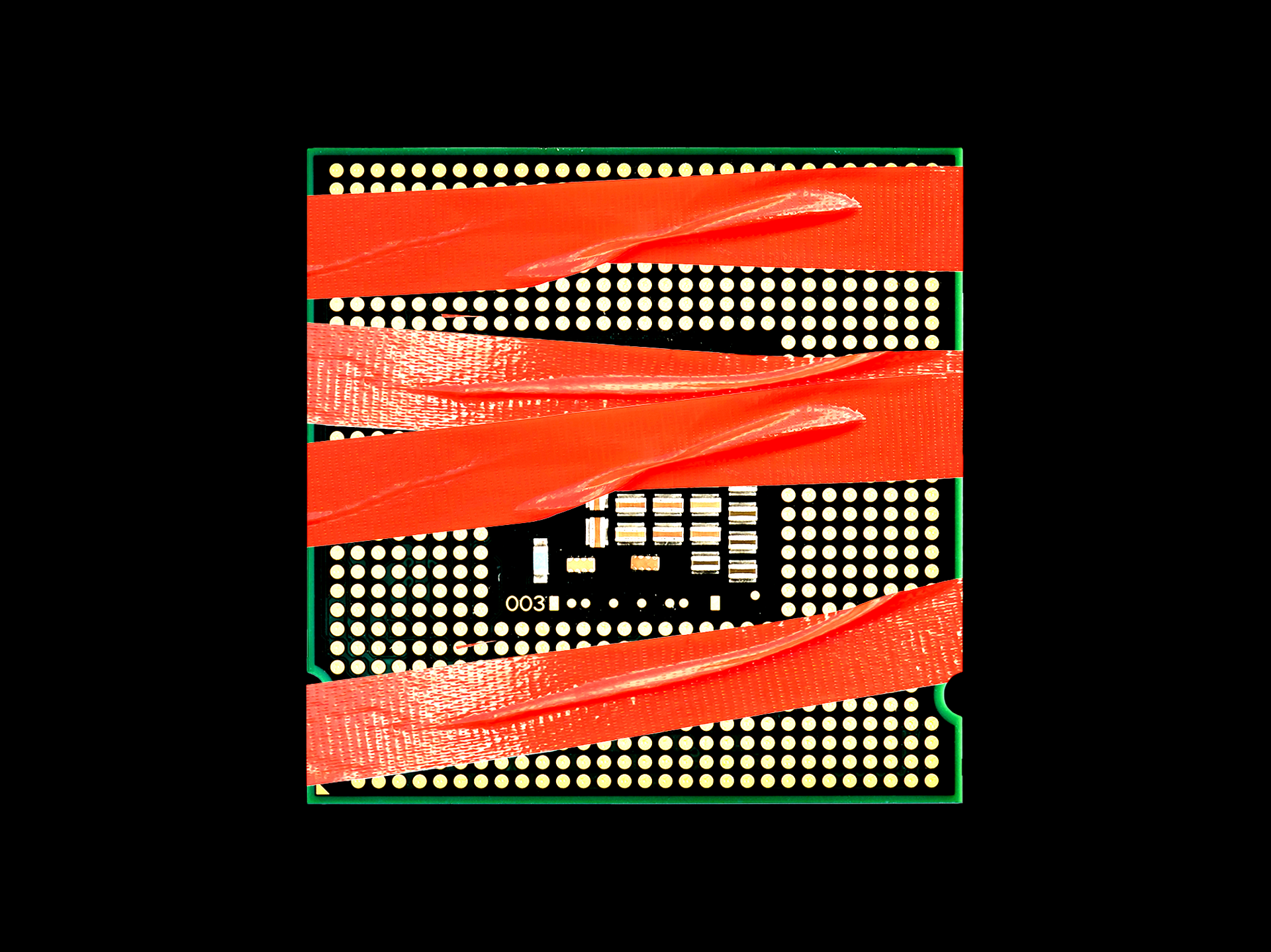 Photo illustration of semiconductor chip covered in red tape