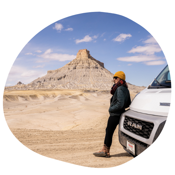 Person on front of van