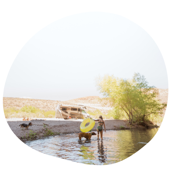 People with dog in the water