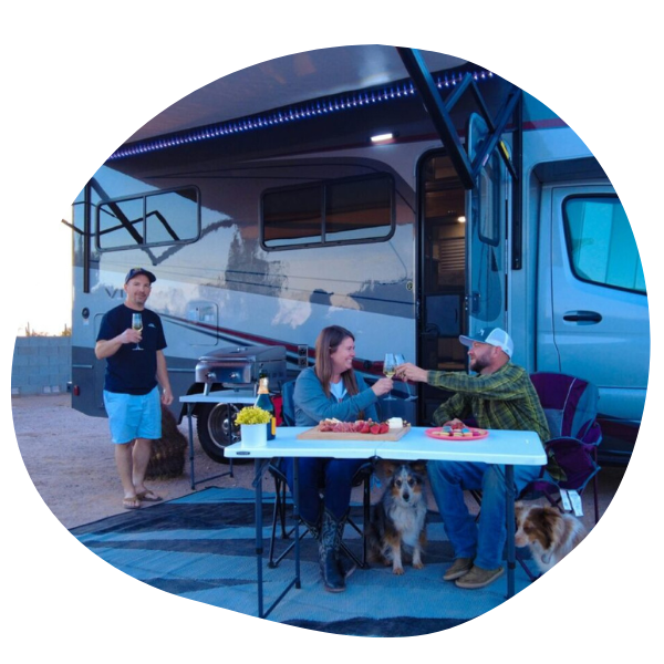 People eating outside of RV