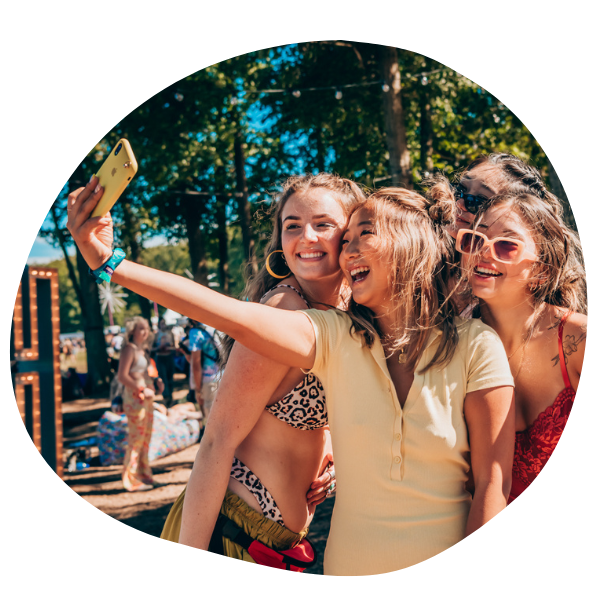 Girls taking picture at festival
