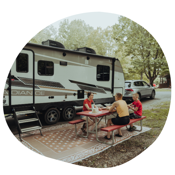 Friends sitting outside RV