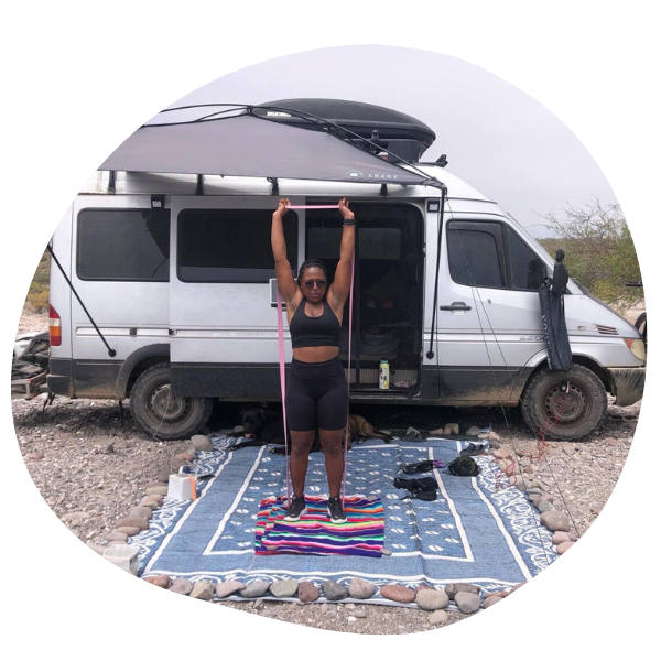 Woman working out outside of van
