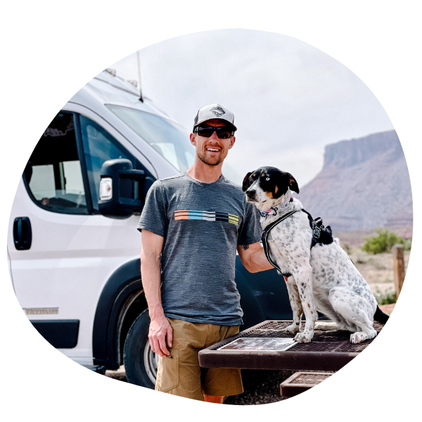 man and dog outside of RV