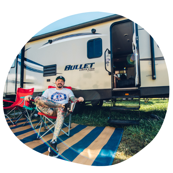 Man sitting outside RV