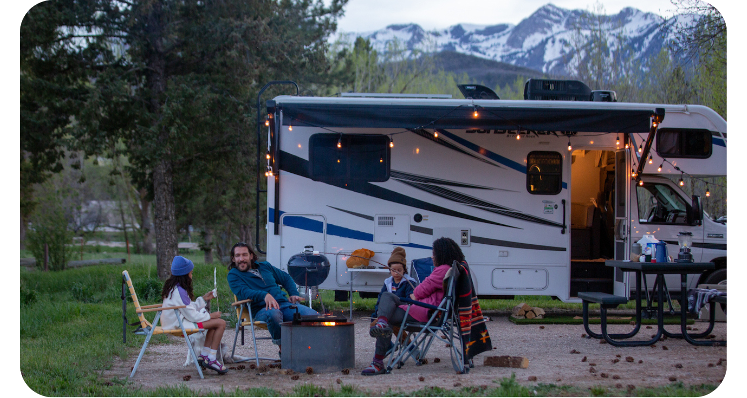 RVs under hot air balloons in sky