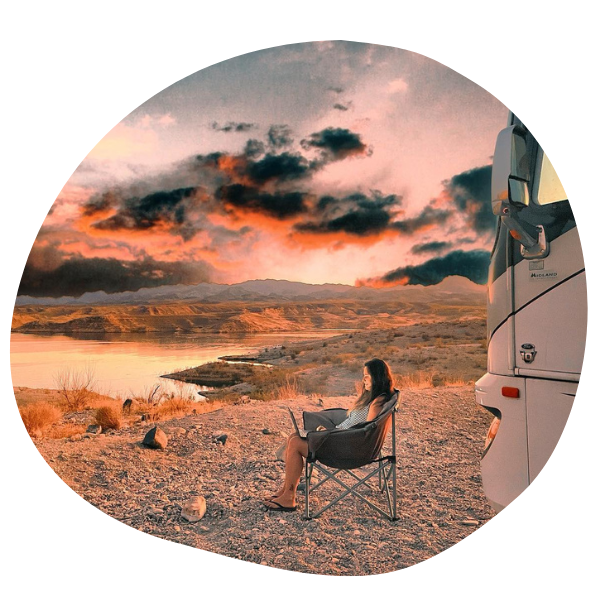 Person sitting in front of RV