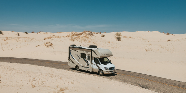 RV on the road in the desert