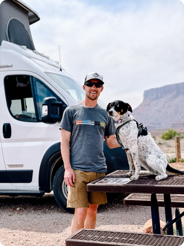 Person outside of RV with dog
