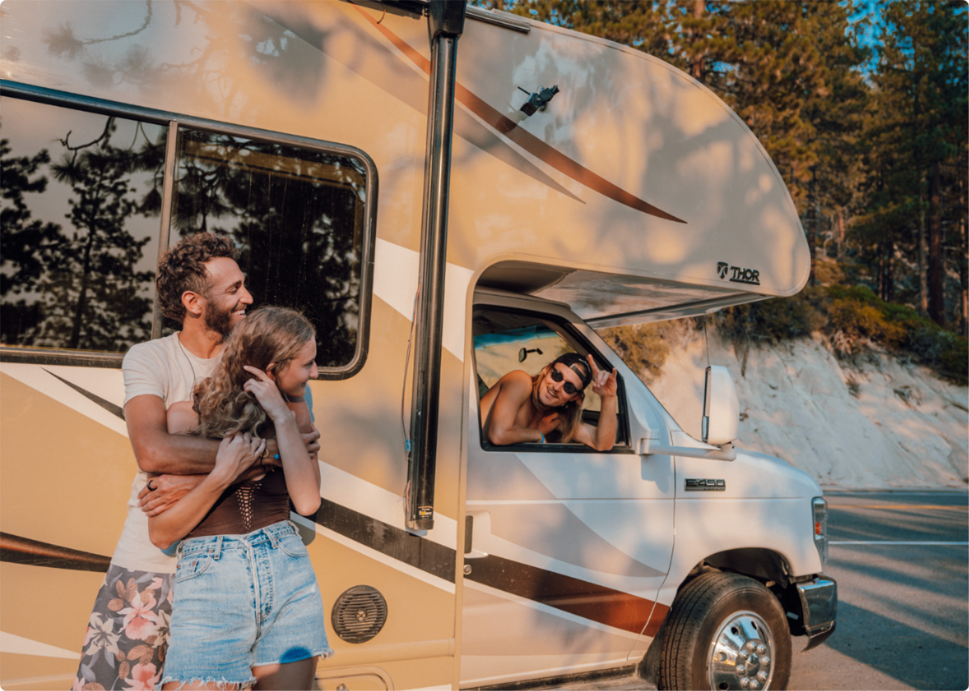 Three people by RV
