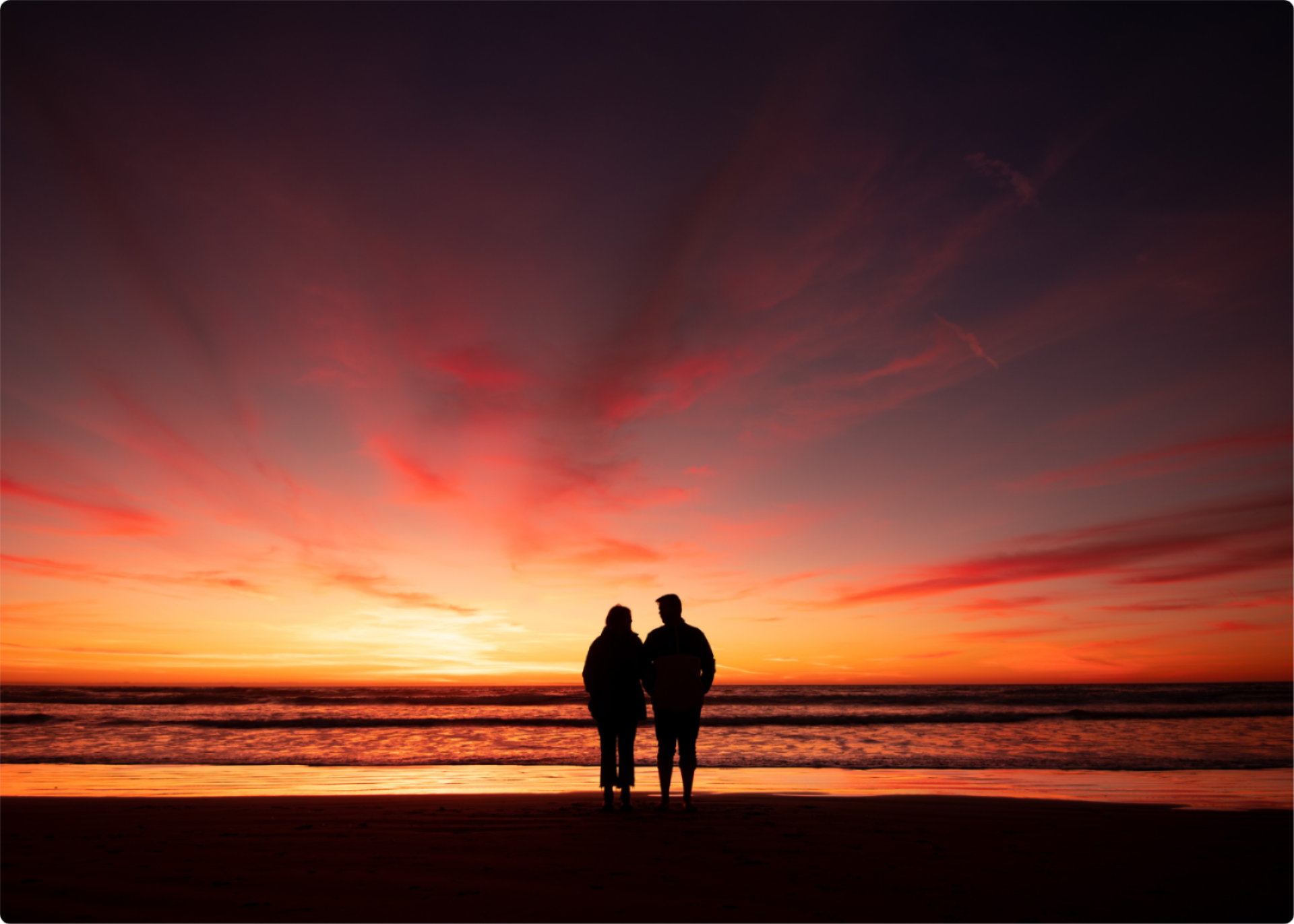 Couple at the beach at sunset