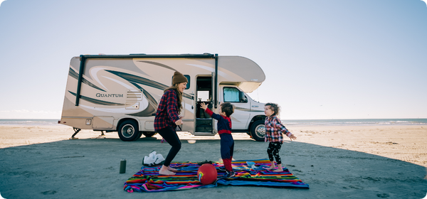 Kids and mom outside of RV