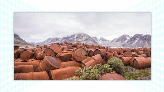 Oil barrels next to mountains