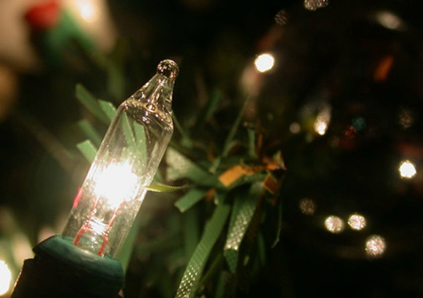 Close up of string lights on Christmas tree.