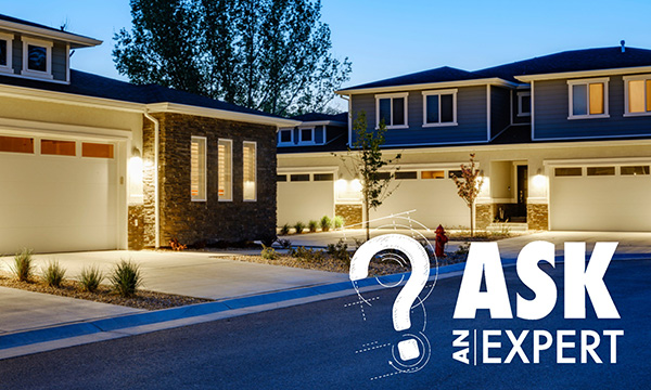 Ask an Expert - Evening time in a neighborhood with two-story stone houses.
