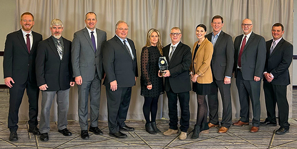 Ihle Fabrications employees accept Iowa Venture Award.