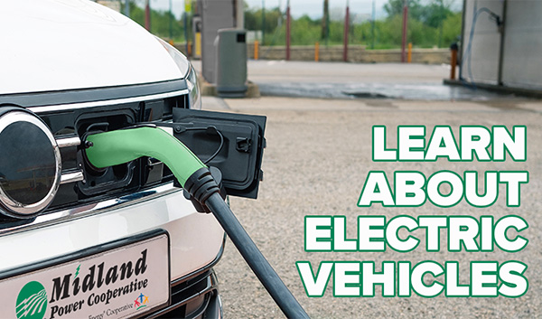 Learn about electric vehicles - electric vehicle charges at fuel station.