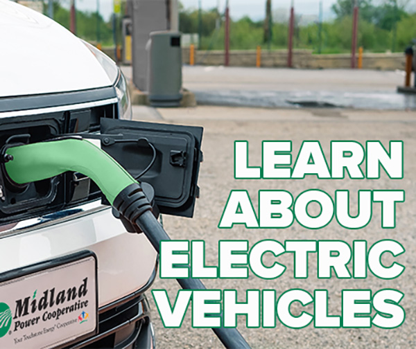 Learn about electric vehicles - electric vehicle charges at fuel station.