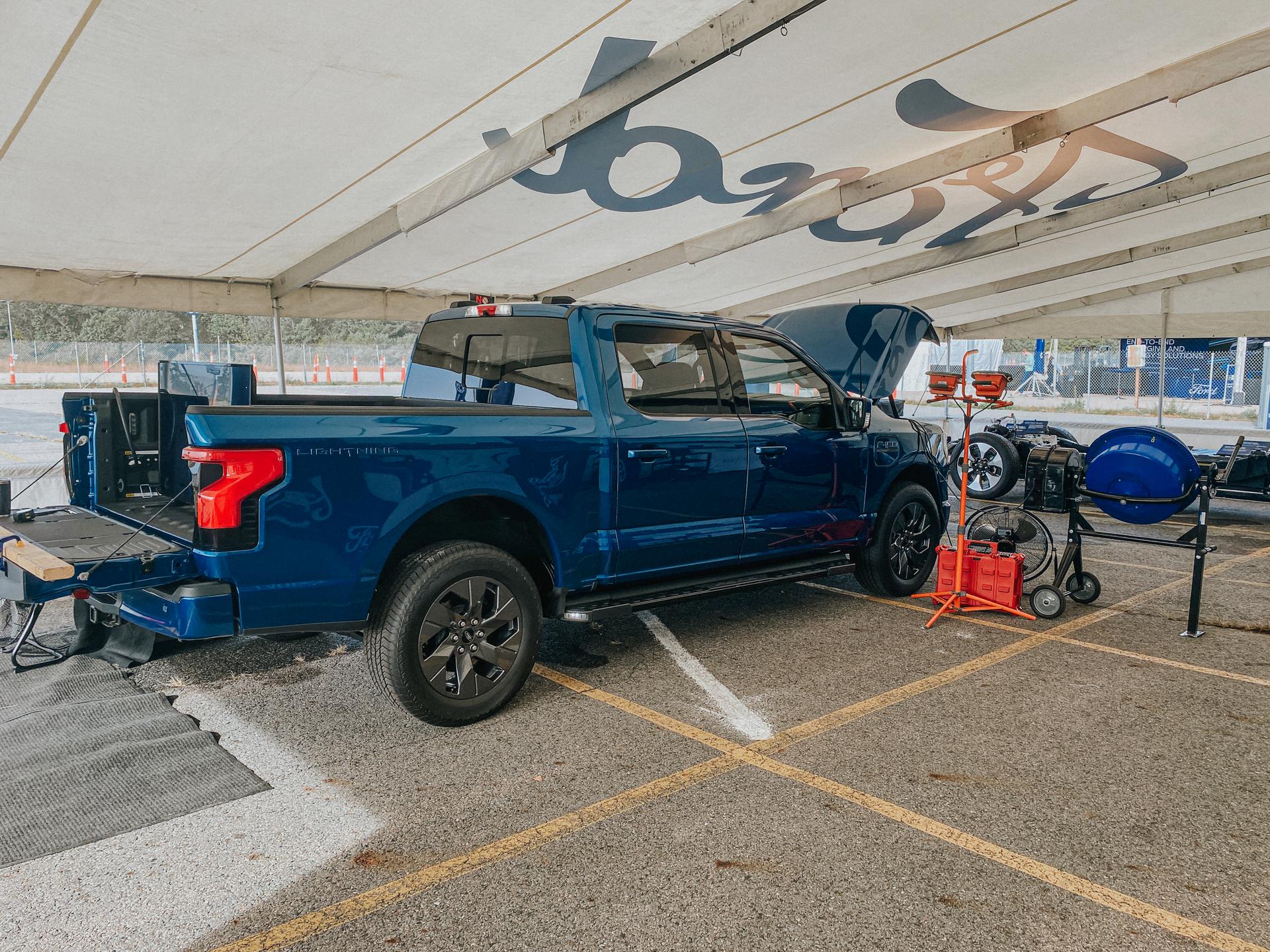 A back-side view of the blue 2022 Ford F-150 Lightning.