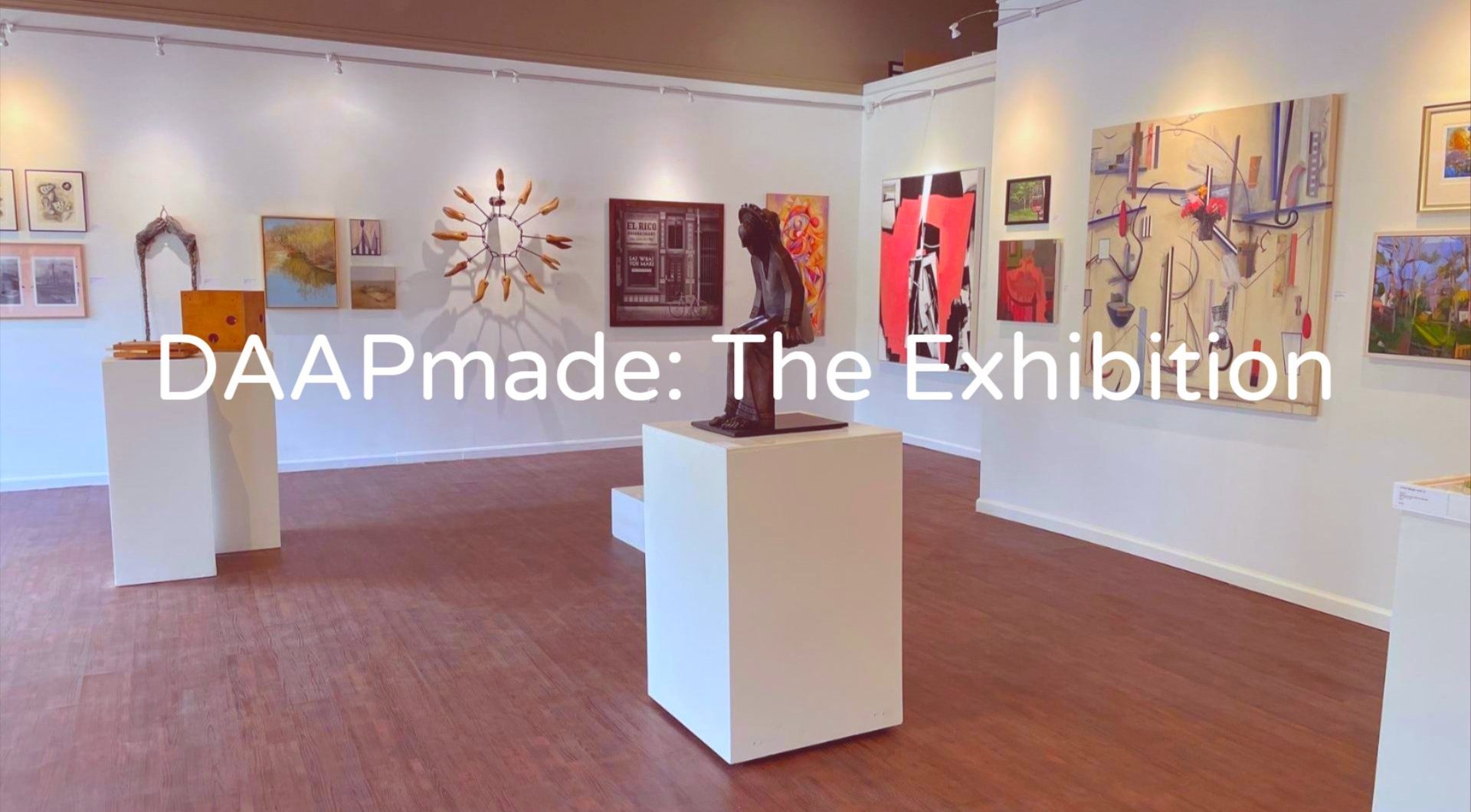 DAAPmade: The Exhibition text over an art gallery